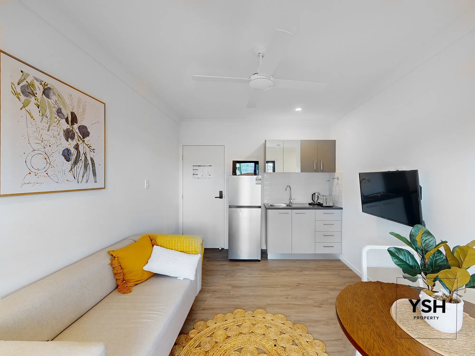 Rooming House Unit Interior – Kitchenette and Living Space | 1 Blackwood Fully furnished rooming house unit with kitchenette, sofa, TV and dining area – designed for modern co-living.