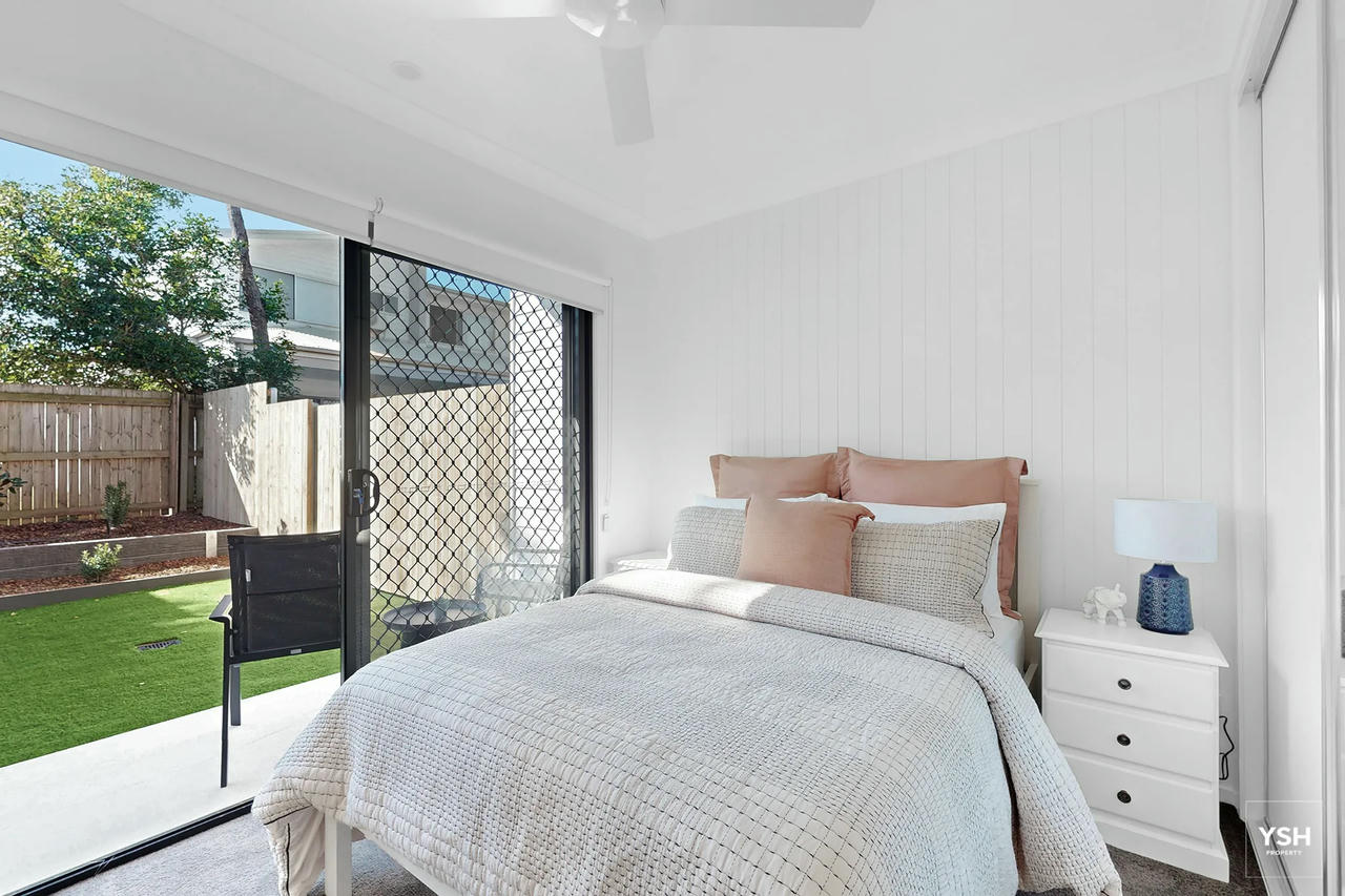 Rooming House Bedroom – Garden Access | Hansen Street Unit 1 Private bedroom in rooming house unit with garden access, natural light and modern furnishings at Hansen Street.